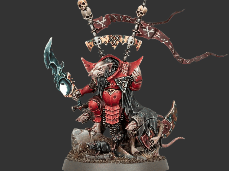 A painted fantasy miniature figurine of a rat-like warrior in red armor, holding a glowing blue sword, with banners, skulls, and rats on a dark gray background.