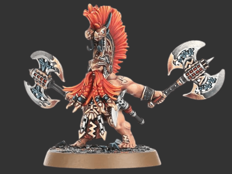A painted fantasy warrior miniature figurine holding two large double-headed axes, standing on a round base against a dark gray background.
