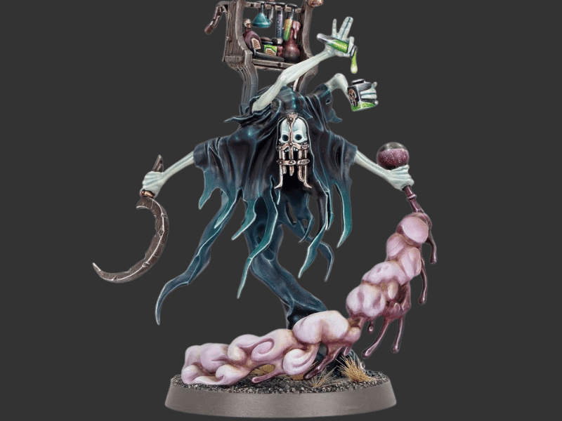 A painted fantasy grim reaper miniature figurine standing on a round base, with a skull face, dark tattered robe, curved scythe, and pink fleshy limbs against a dark gray background.