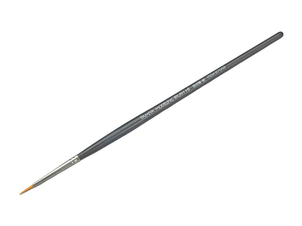 Paintbrush with a gray handle on a light gray background