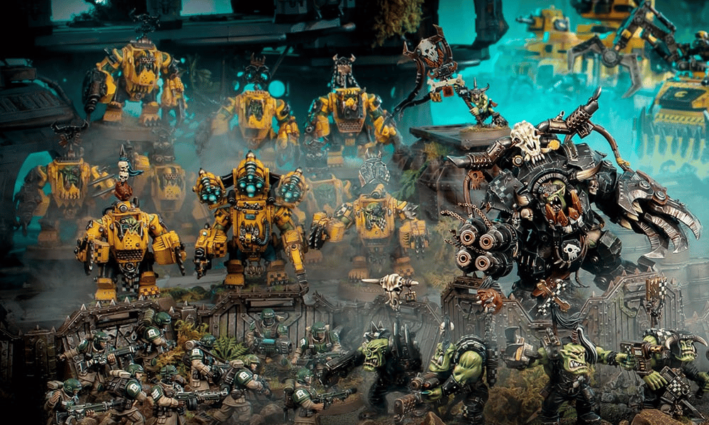 Collection of detailed miniature figures in a fantasy setting with various characters and vehicles.