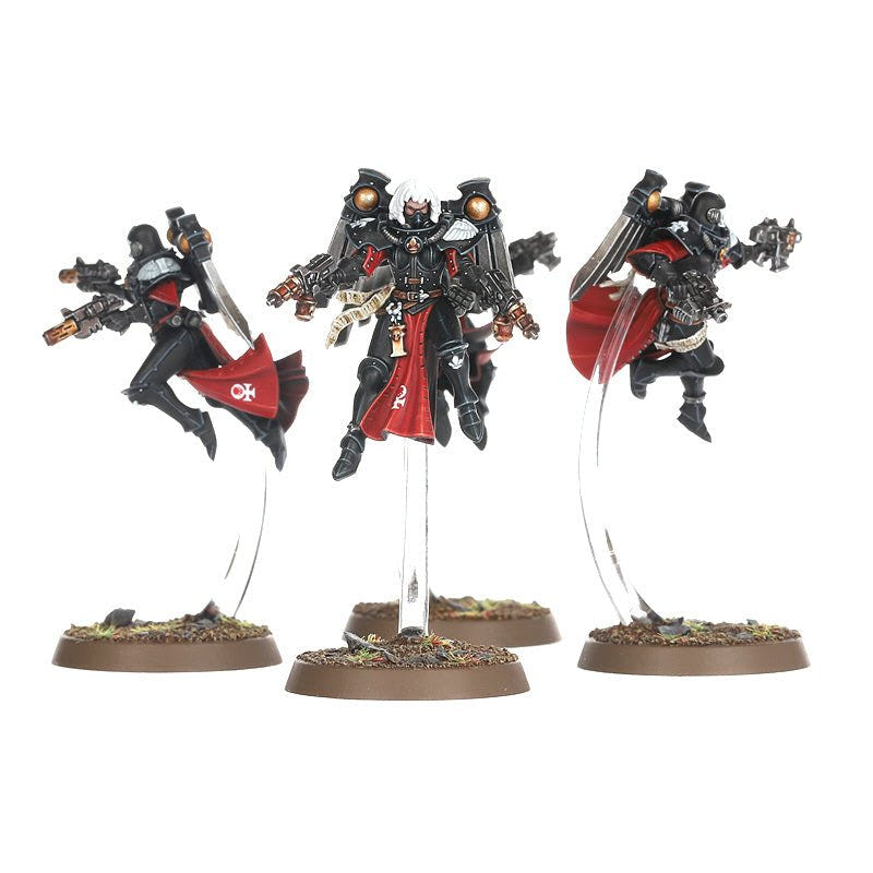 Three painted Seraphim in flight with twin pistols and red cloaks