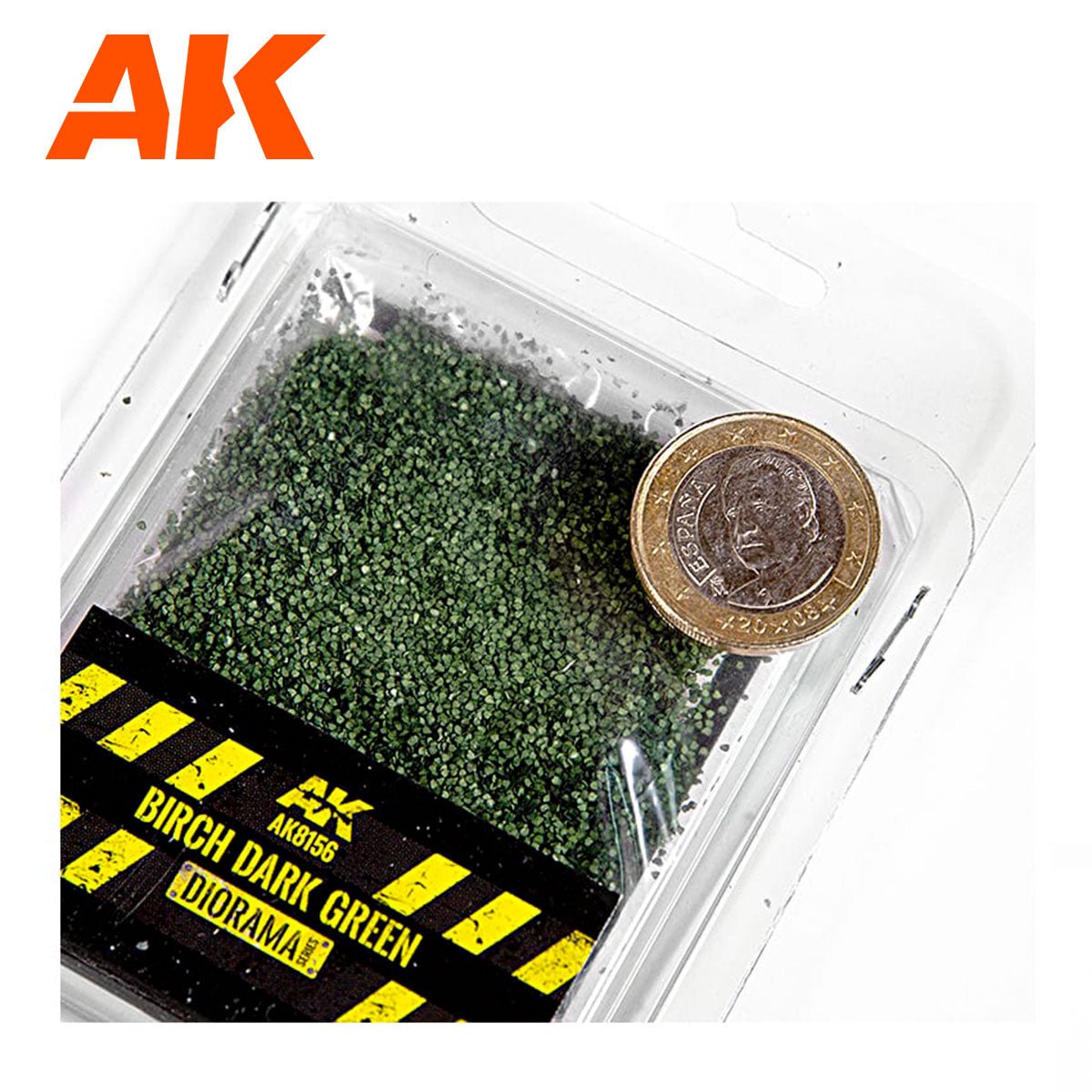 AK Interactive Birch Dark Green 28mm 1/72 scale leaves in the open tray beside a coin for scale