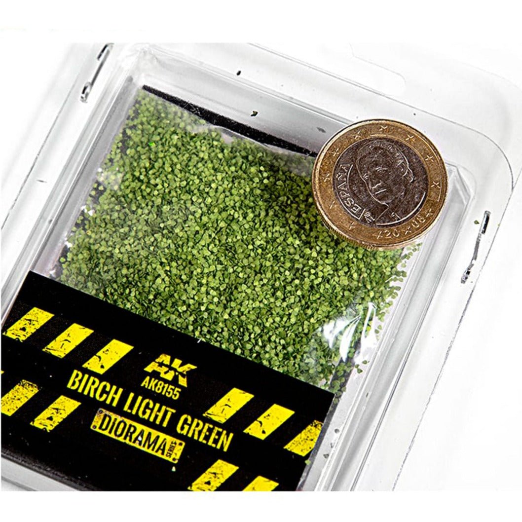 AK Interactive Birch Light Green Leaves AK8155 in a clear tub with a coin for scale