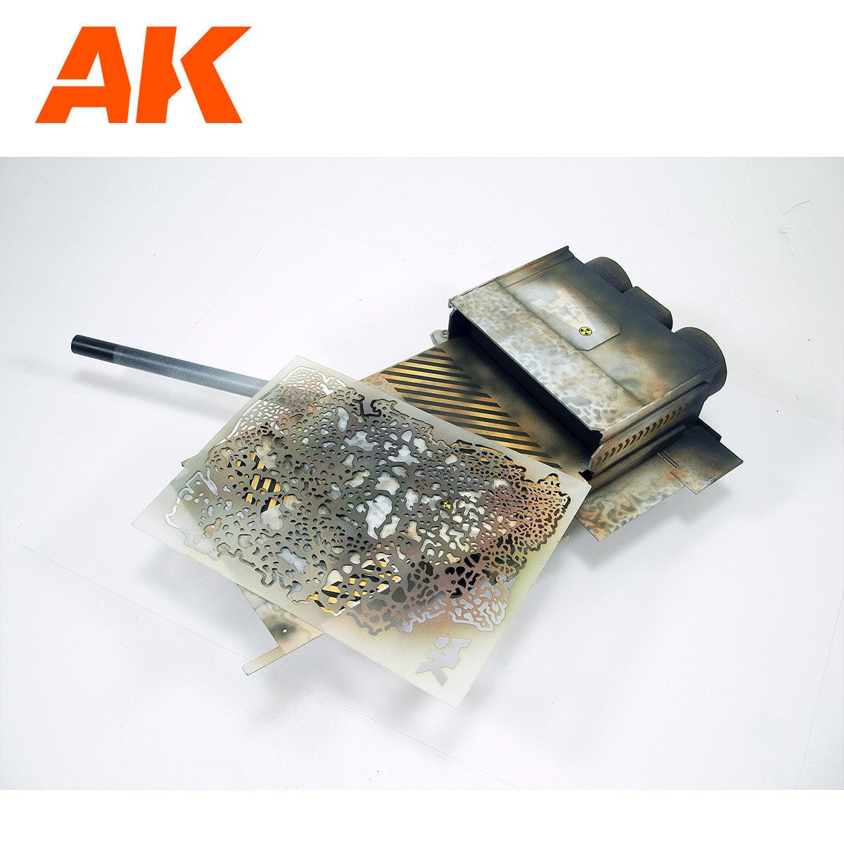 AK Interactive flexible airbrush stencil laid on a weathered model part after spraying