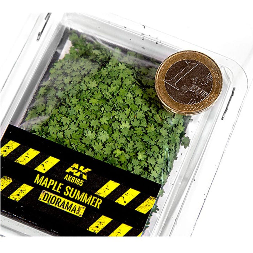 Tub of AK Interactive Maple Summer leaves beside a coin to show their small scale