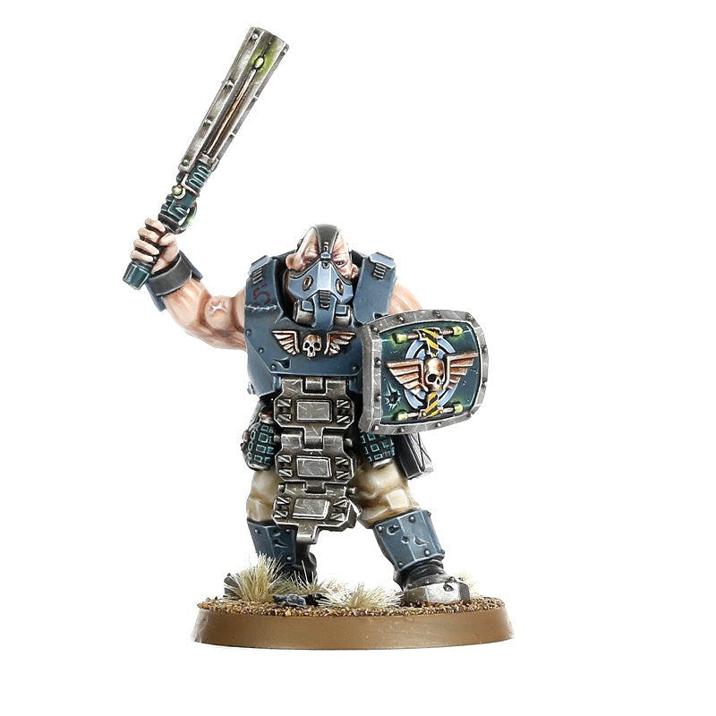 Painted Bullgryn raising a power maul with a round brute shield bearing an Imperial eagle