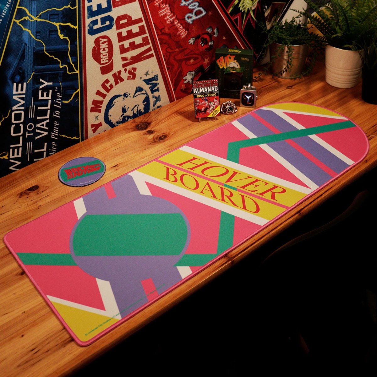Back to the Future hoverboard desk pad with coaster on a wooden desk setup