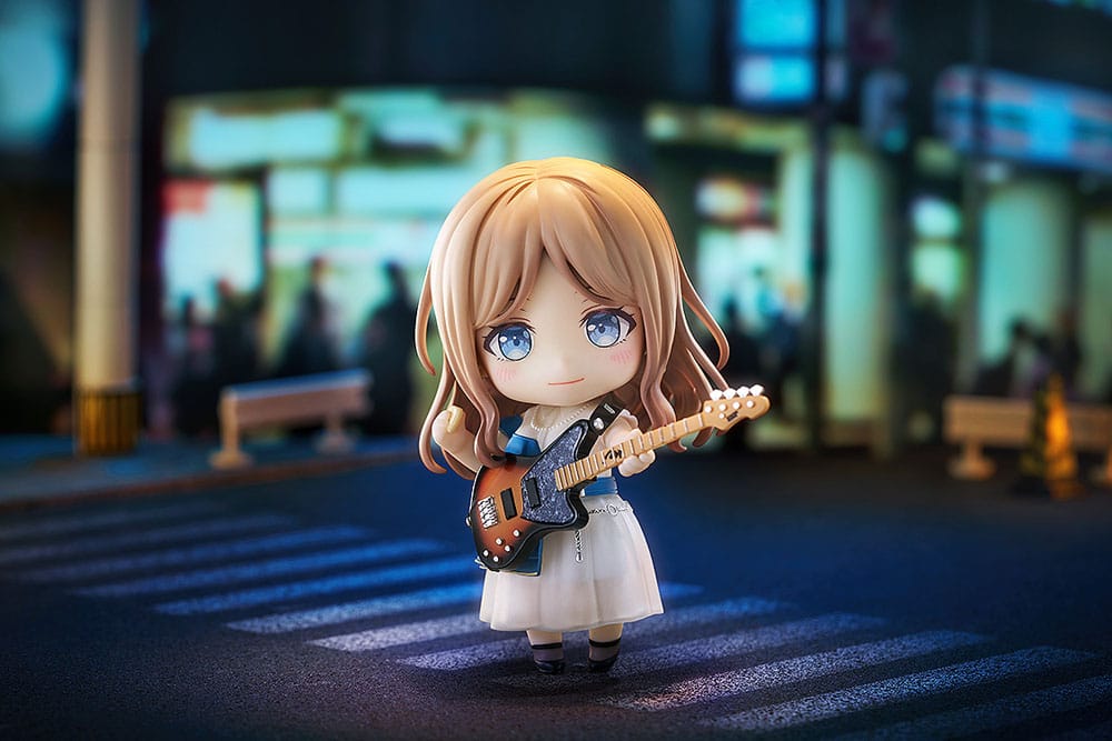 Soyo Nagasaki Nendoroid with bass photographed on a city crossing at night