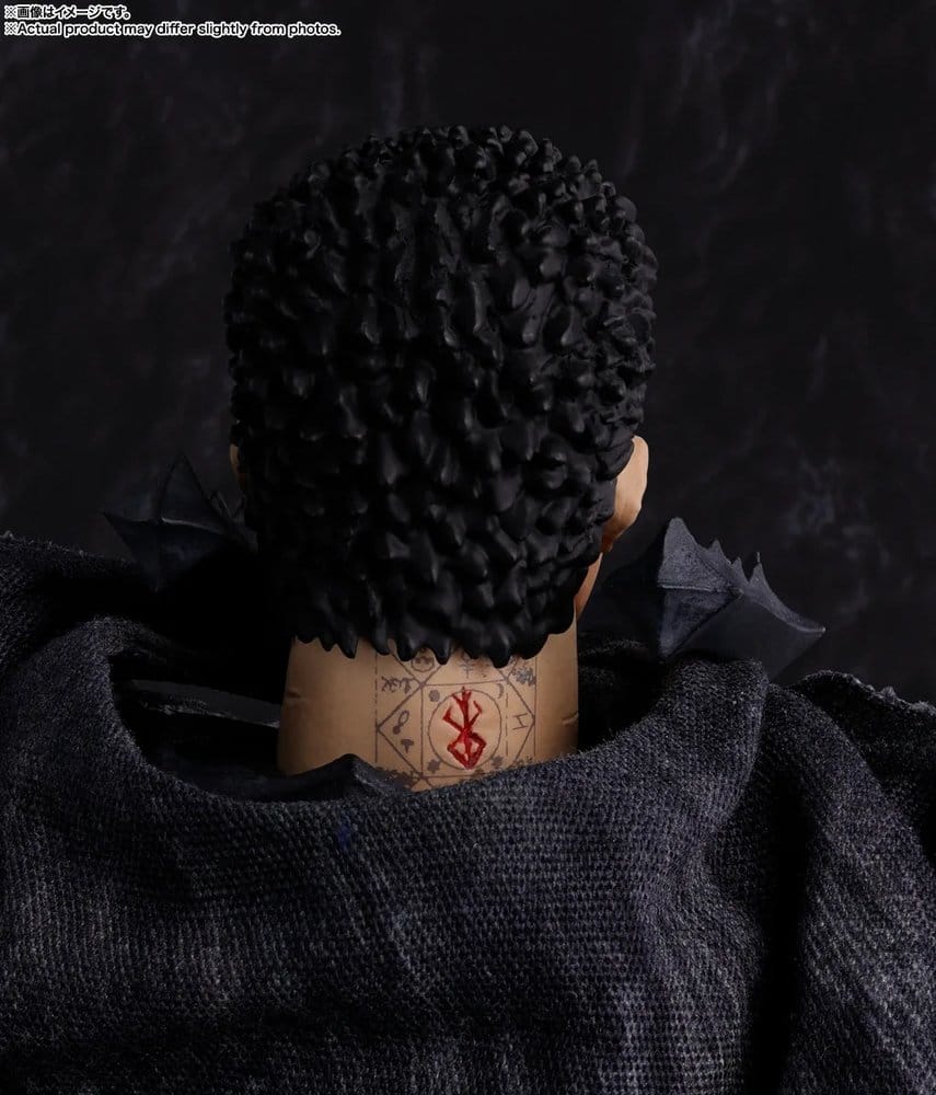 Close-up of the Guts figure's neck showing the red brand mark detail