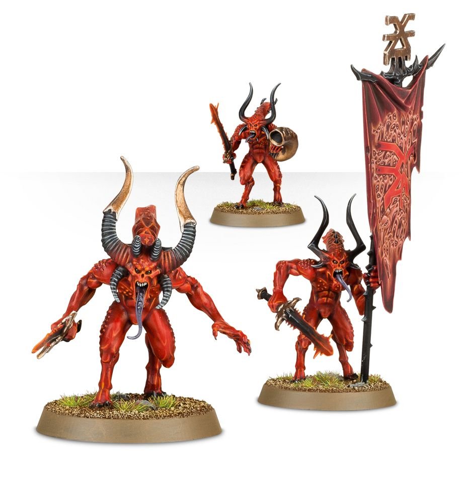 Three painted Bloodletters including the standard bearer with a red banner of Khorne