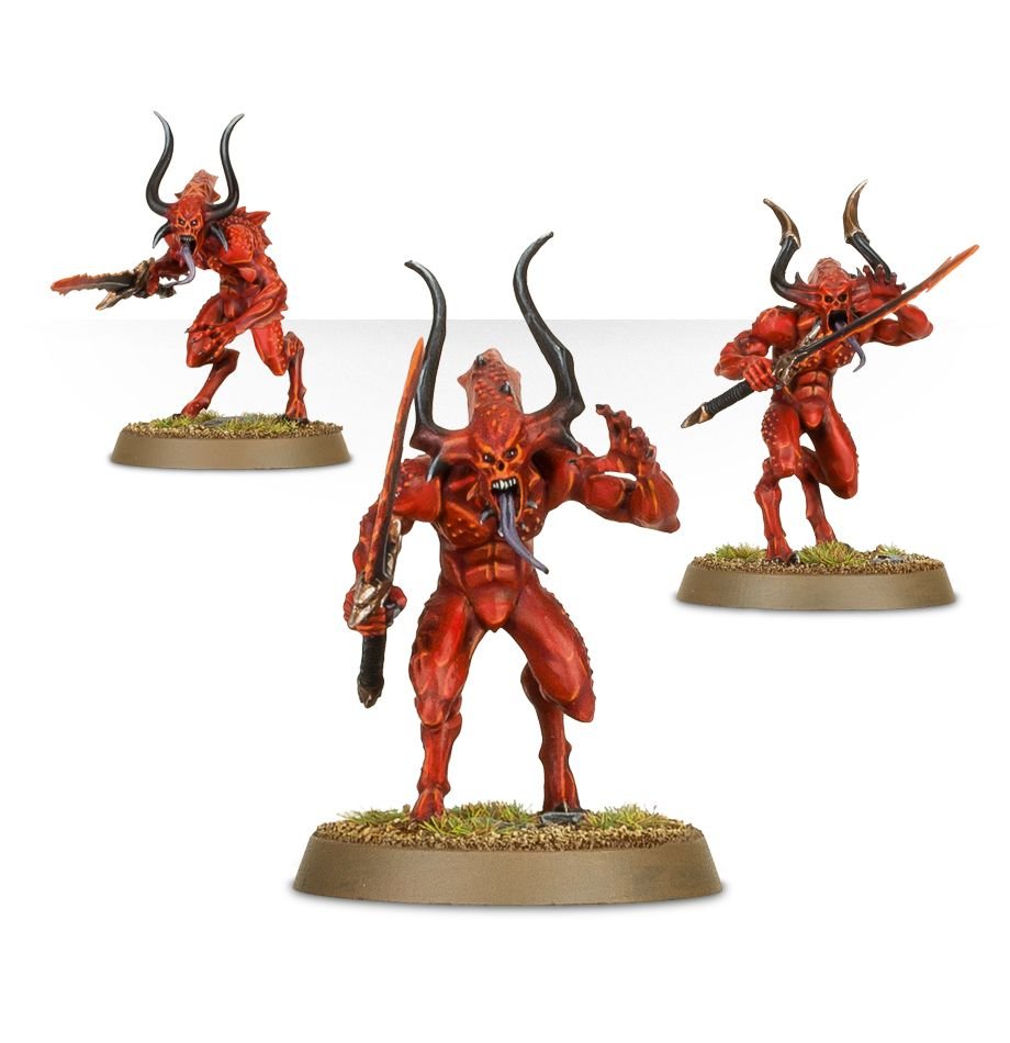 Three painted Blades of Khorne Bloodletters with hellblades in attacking poses
