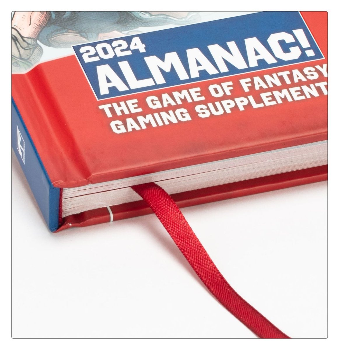 Close-up of the Blood Bowl Spike! Almanac 2024 hardback spine with red ribbon bookmark