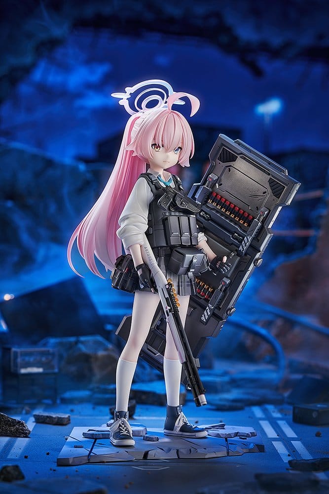 Hoshino Armed 1/7 figure on rubble base shown in a dark ruined city setting