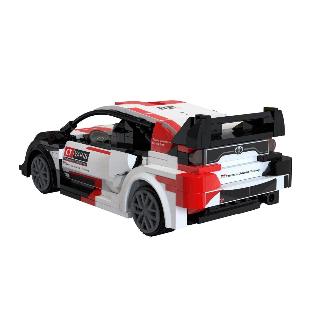 CaDA 1:20 Toyota GR Yaris Rally1 brick kit, built car, rear three-quarter view with wing