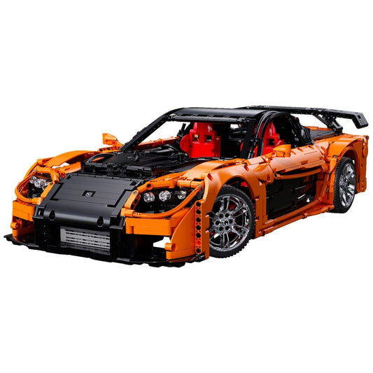 CaDA 1/8 Mazda RX-7 brick car model built in orange and black with a large rear wing