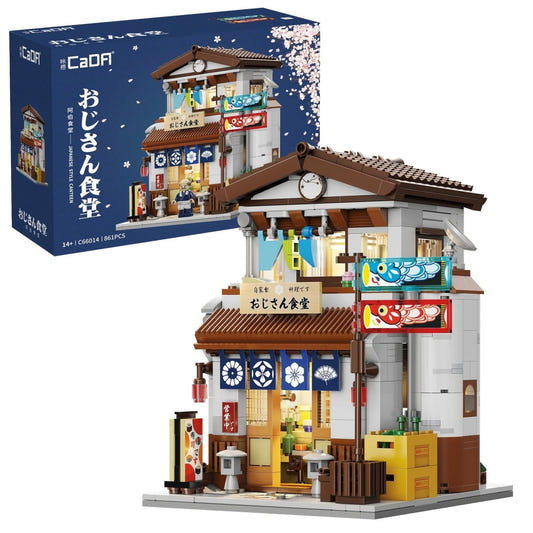 CaDA Japanese Style Canteen brick building with noren curtains and lanterns, beside its box