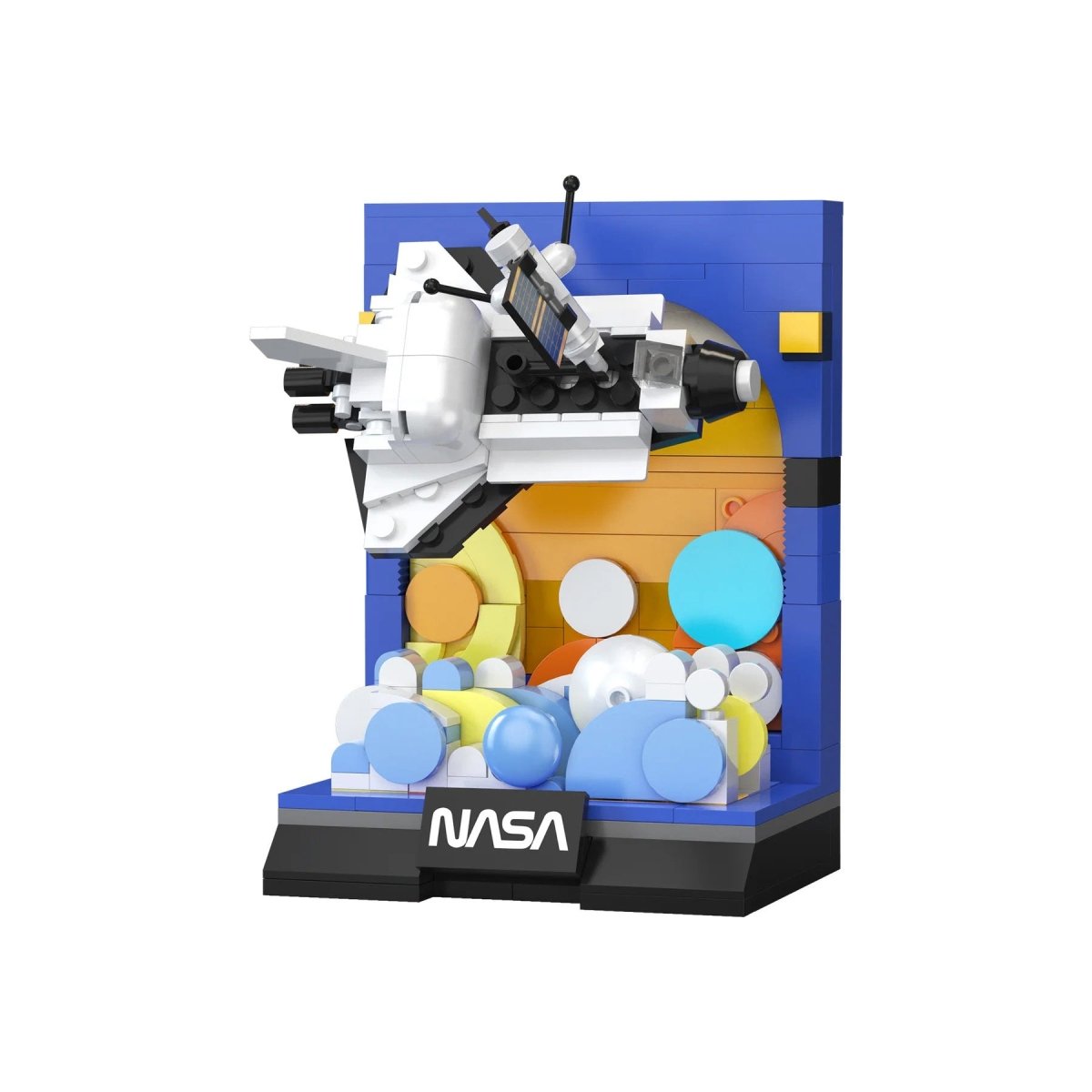 CaDA Space Shuttle Discovery brick model built on a NASA display base with a colourful planet backdrop