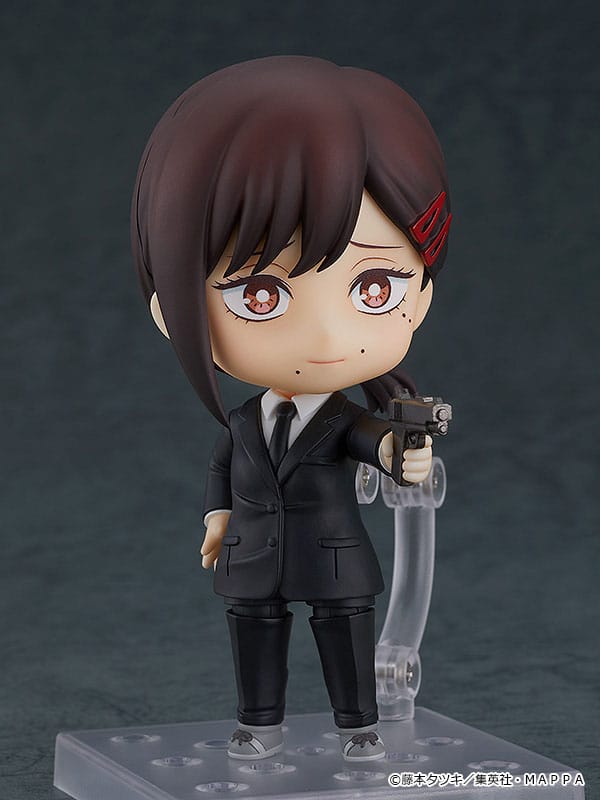 Kobeni Nendoroid aiming a handgun with a worried look