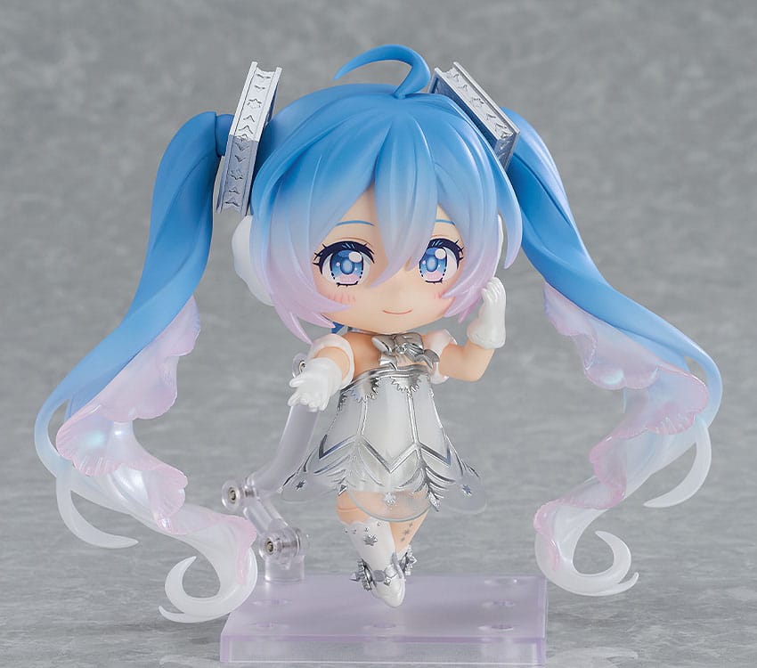 Hatsune Miku Symphony Sapporo Nendoroid smiling with one hand raised, front view