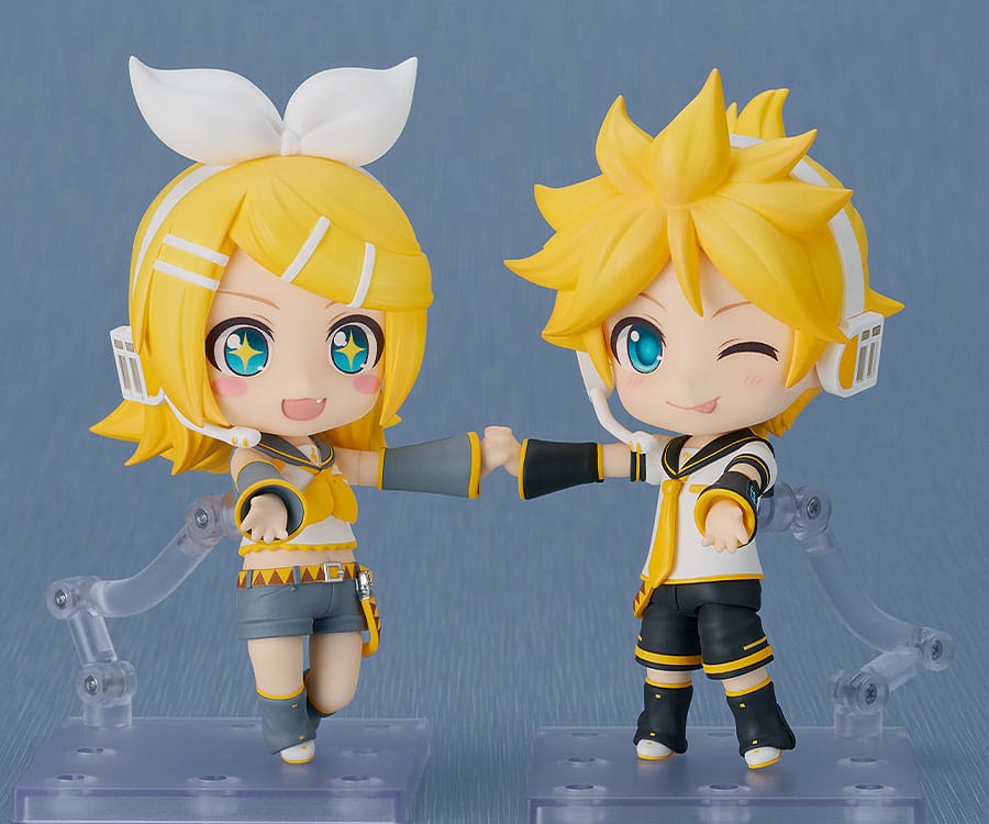 Kagamine Len 2.0 Nendoroid winking while holding hands with a Kagamine Rin Nendoroid
