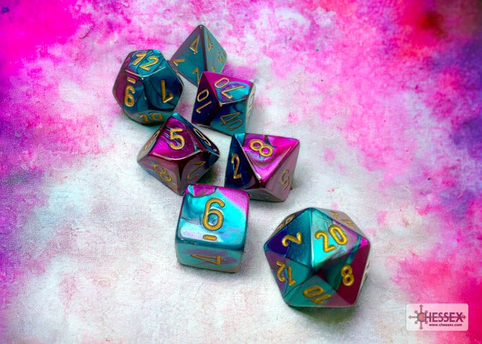 Chessex Gemini Purple-Teal dice set on a pink and purple backdrop