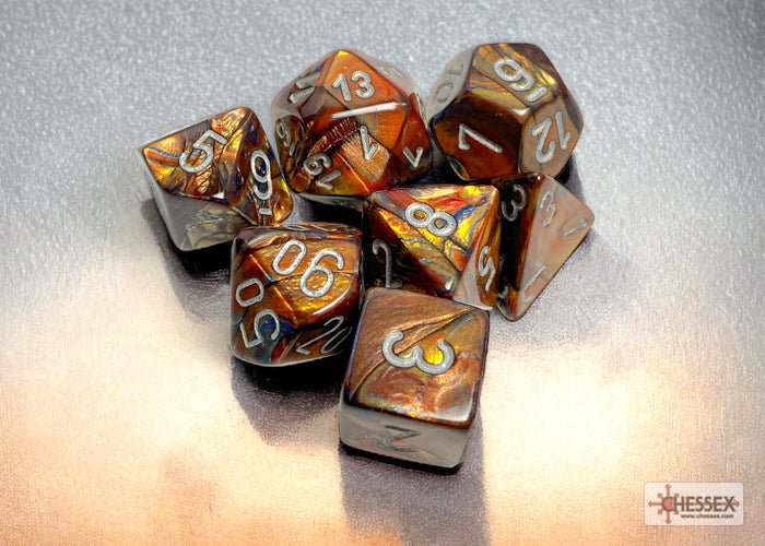 Chessex Lustrous Gold 7 dice set with silver numbers on a light backdrop