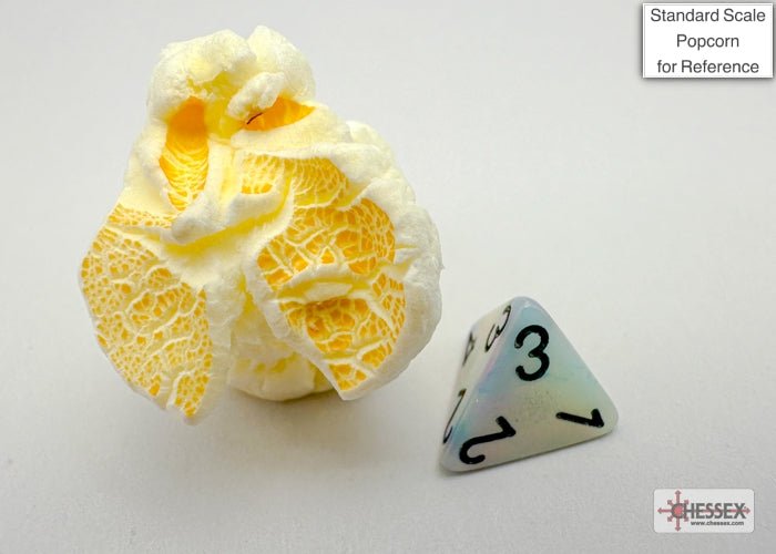 Chessex Mini Festive Circus d4 beside a piece of popcorn to show the mini dice size