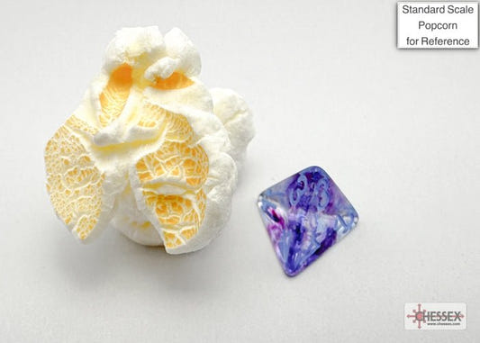 Chessex Mini Nebula Nocturnal Blue die next to a piece of popcorn for size comparison