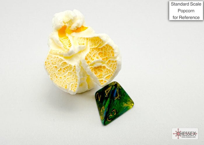 Chessex Mini Scarab Jade d4 beside a piece of popcorn to show the mini dice size