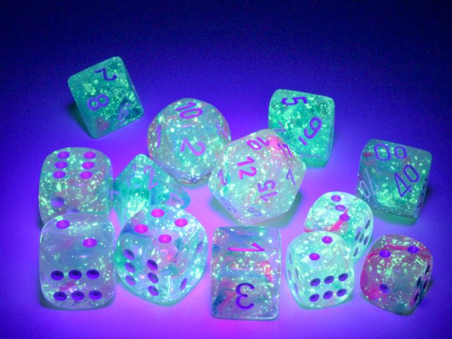 Chessex Nebula Luminary Wisteria D6 dice glowing under UV light