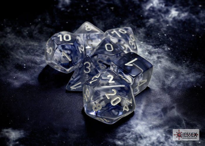Chessex Nebula black and white 7 dice set on a dark starry backdrop