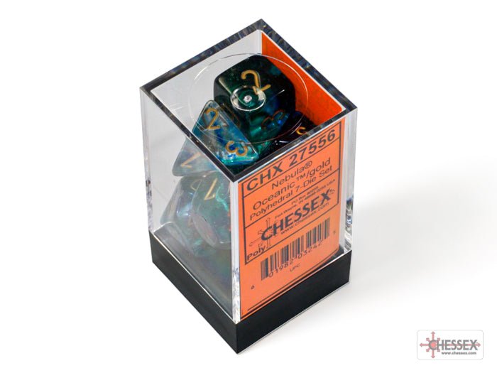 Chessex Nebula Luminary Oceanic Gold dice set in its clear display box