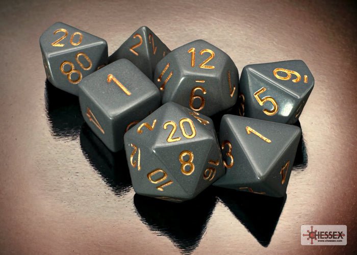 Chessex Opaque Dark Grey with Copper dice grouped on a dark reflective surface