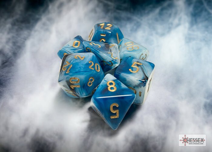 Chessex Phantom teal and gold polyhedral dice set on a smoky blue backdrop