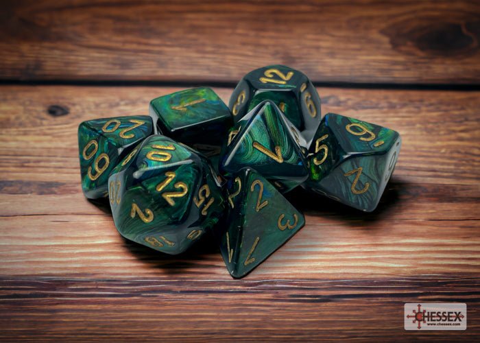 Chessex Scarab Jade with Gold polyhedral dice set on a wooden table