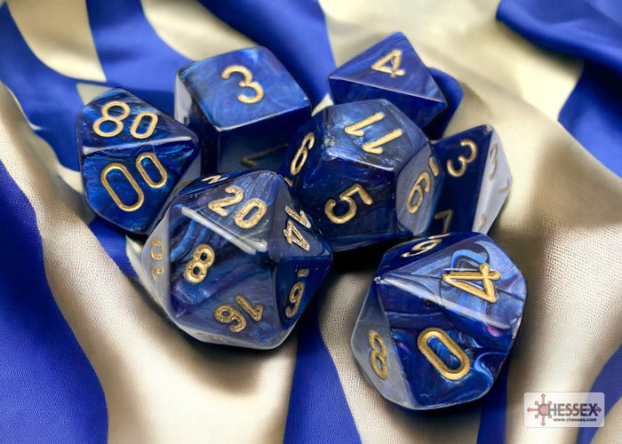 Chessex Scarab Royal Blue with Gold dice resting on draped blue and gold fabric