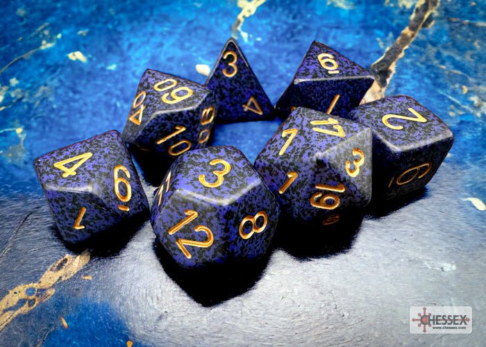 Chessex Speckled Golden Cobalt polyhedral dice arranged in a ring on a blue backdrop