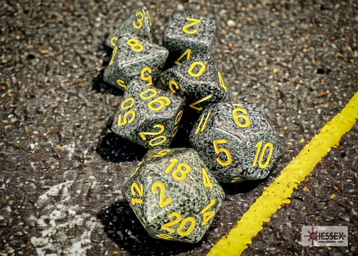 Chessex Speckled Urban Camo dice on tarmac next to a yellow road line