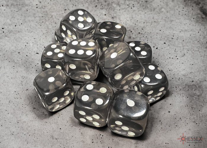 Chessex translucent smoke 16mm D6 dice with white pips on a concrete surface