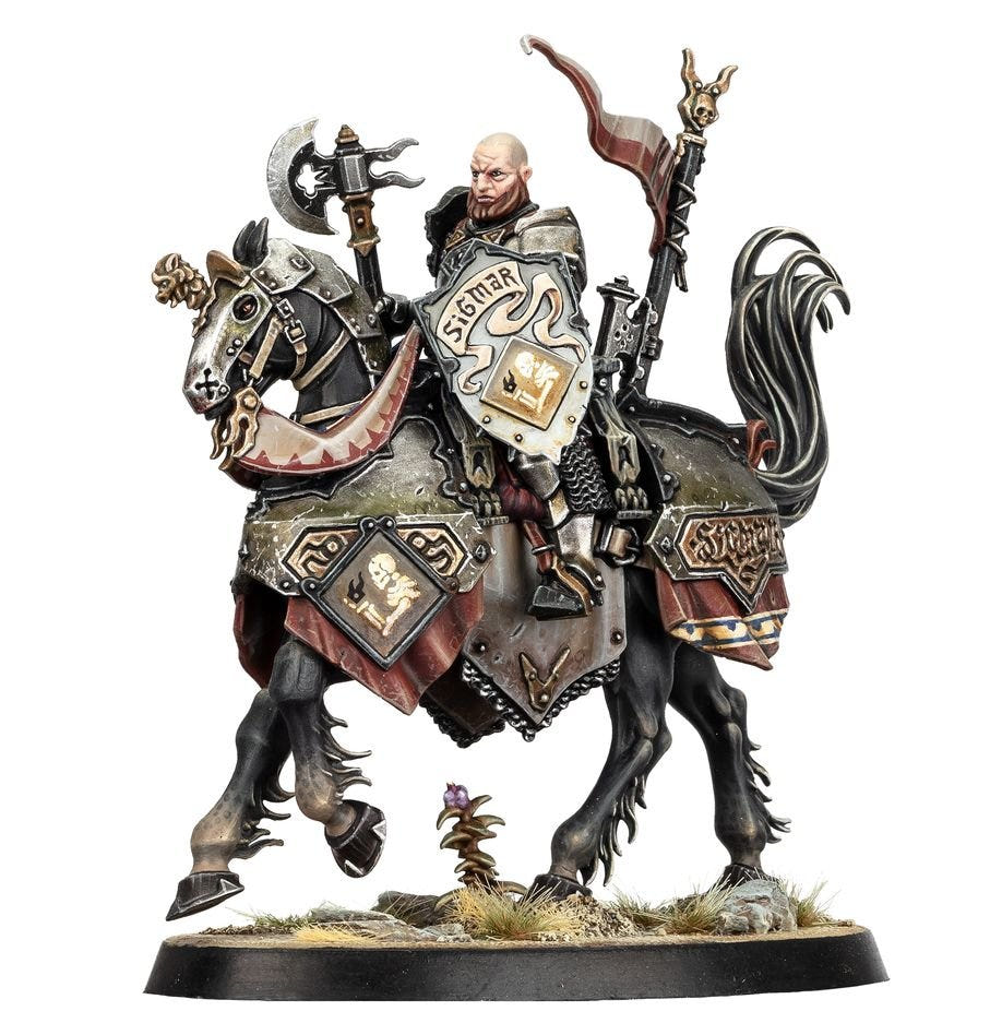 Painted bare-headed Freeguild rider with axe and Sigmar shield on an armoured warhorse