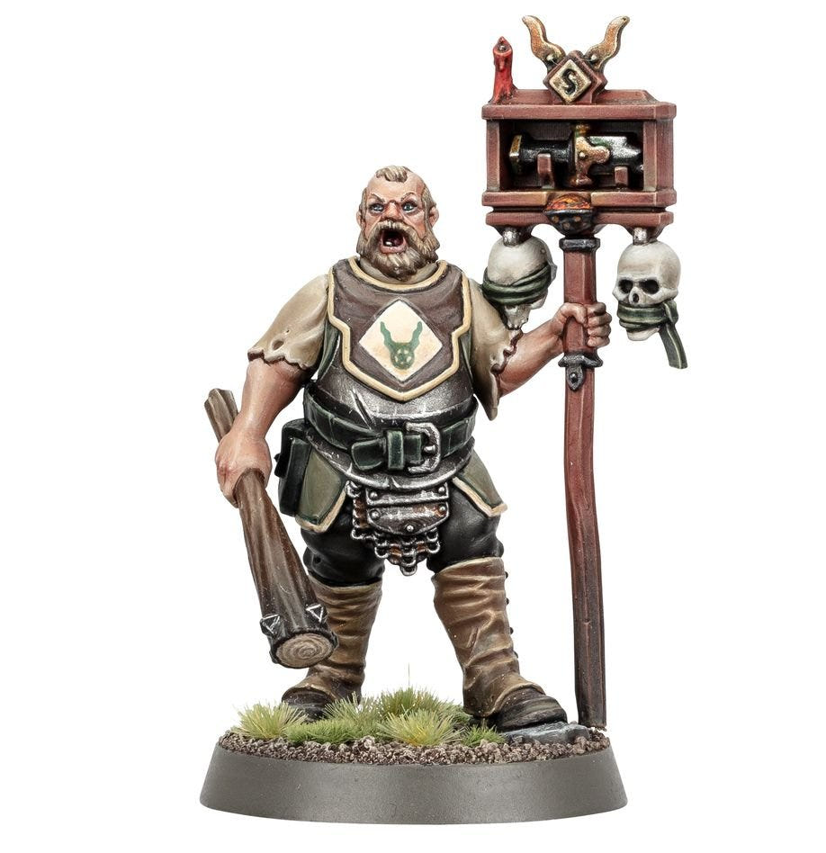 Painted Freeguild Steelhelm bellowing, carrying a shrine staff and wooden club, front view