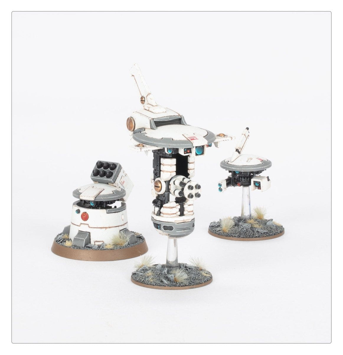 Painted T'au drones and support turret on clear flying stems