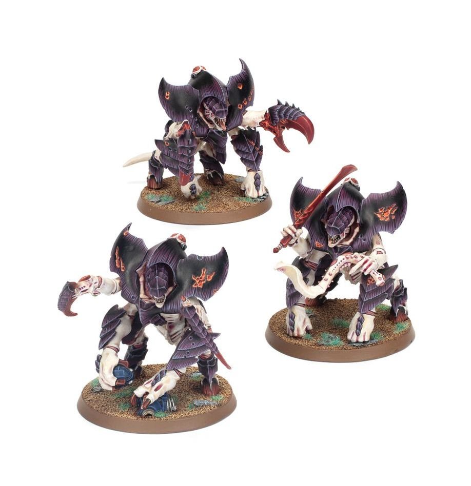 Three painted Tyranid Tyrant Guard in purple carapace with scything talons