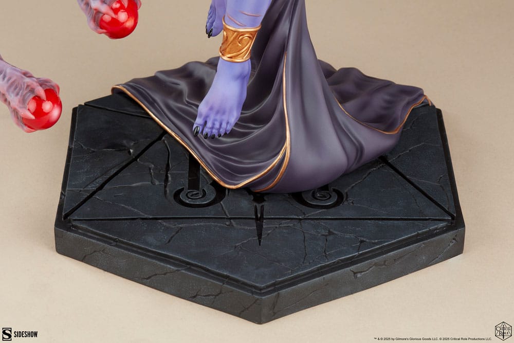 Close-up of the black hexagonal faux-stone base with the Mighty Nein monogram, Lucien statue