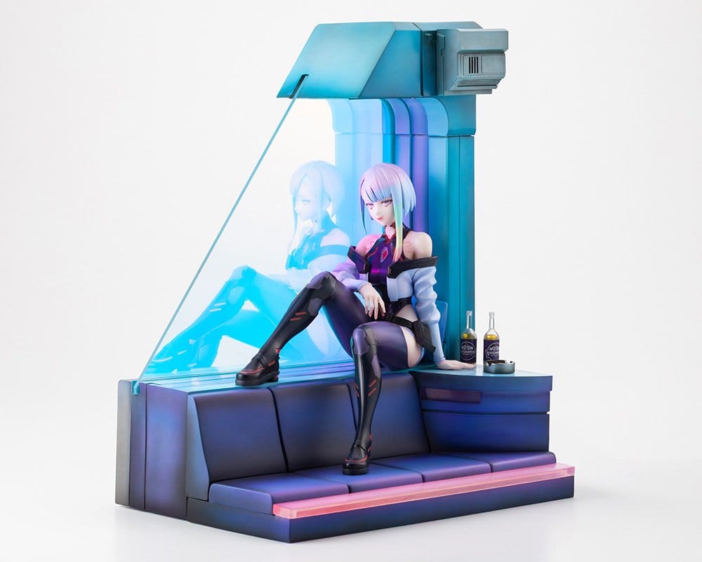 Lucy figure on the diorama sofa with clear window panel and bottles on the side