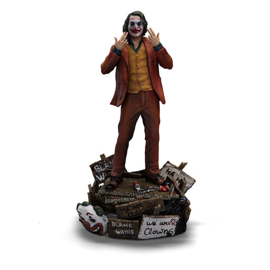 Iron Studios Joker (Arthur Fleck) Deluxe 1/10 statue with fingers to his smile on a protest-sign base