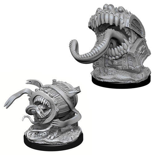 Two unpainted WizKids Nolzur's Marvelous Mimic miniatures, one as a chest and one as a barrel