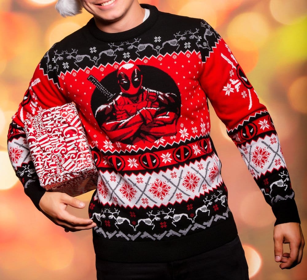 Person holding a wrapped present wearing the Deadpool Christmas jumper, front view