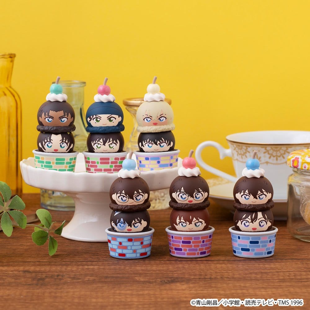 Six Detective Conan Tsumichen figures displayed on cake stands at a tea table